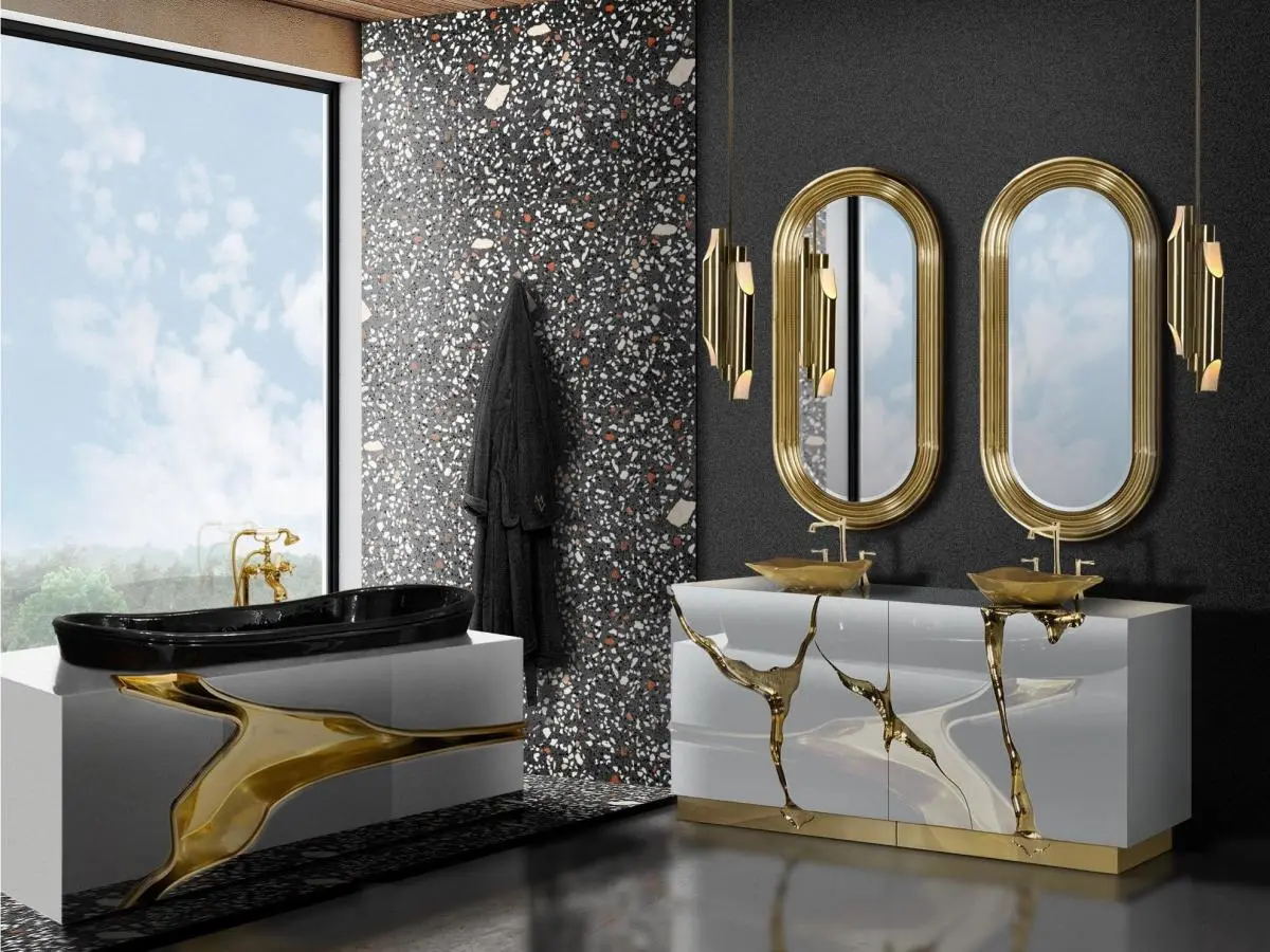 Bagno moderno con dettagli in oro e lavabo Lapiaz