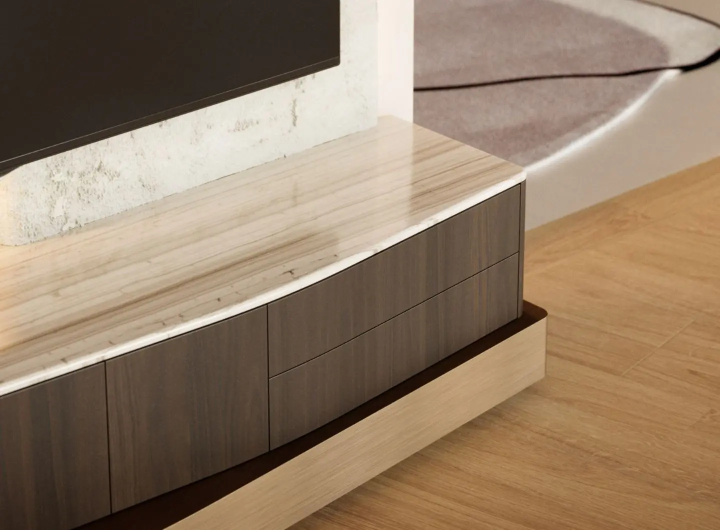 Uno sguardo ravvicinato al mobile TV in pietra ne rivela la struttura a strati che combina legno, marmo e dettagli in ottone, con una sezione contenitiva in legno sotto un piano in marmo lucido e delicati accenti in ottone, il tutto incorniciato da una parete ruvida in un ambiente contemporaneo.